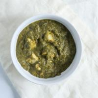 Palak Paneer · Fresh spinach cooked with cottage cheese delicately spiced.