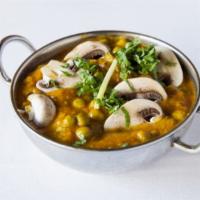 Mushroom Mattar · Vegan. Sautéed mushroom and green peas cooked in herbs and spices.
