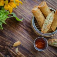 Egg Rolls · Crispy vegetarian rolls: vegetables, taro and silver noodles with homemade sweet chili sauce...