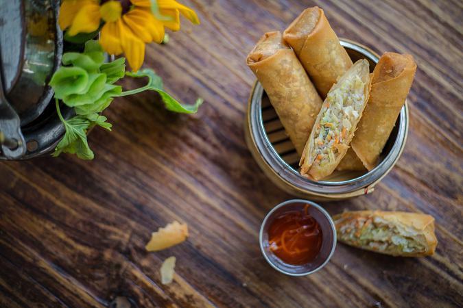 Egg Rolls · Crispy vegetarian rolls: vegetables, taro and silver noodles with homemade sweet chili sauce. Served 3 Rolls cut in half