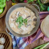 Tom Kha Gai. · Traditional Thai chicken soup in coconut milk, seasoned with mushroom, lemongrass, and galan...