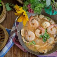 Tom Yum Goong · Our famous Bangkok Style Tom Yum soup spiced with prawns, the heart of palm, fresh young coc...