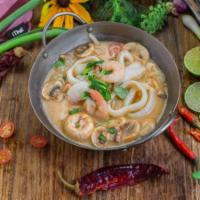 Tom Yum Seafood · Our famous Bangkok style Tom Yum soup spiced with combination seafood, the heart of palm, fr...