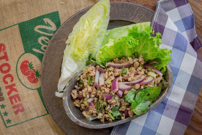 Larb · Choice of minced chicken, pork or tofu seasoned with shallots, mint leaves, lime, dried chili flake, and roasted rice powder. Available substitution with other meat or seafood (chicken, pork, beef, tofu with no charge, shrimps, calamari, fish, seafood or duck for an additional charge). Medium spicy