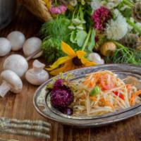 Som Tum · Green papaya, string beans, tomatoes, and nuts tossed in sweet garlic lime dressing. Mild sp...