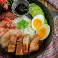 Kao Moo Dang · IThai 3 styles of pork, roasted pork, crispy pork belly, pork sausage and boiled egg over ri...