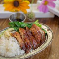 Kao Na Ped Yang · Boneless roasted duck over rice with delicious brown gravy sauce