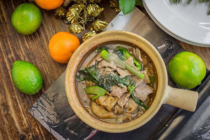 Rad Na Moo · Stir-fried wide rice noodle with pork, Chinese broccoli in Thai gravy sauce. Available substitution with other meat or seafood (chicken, pork, beef, tofu with no charge, shrimps, calamari, fish, seafood or duck for an additional charge)
