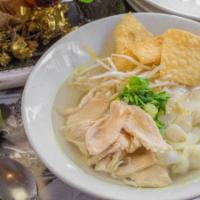 Thai Chicken Noodle Soup · Flat rice noodles in clear broth with sliced tender chicken and bean sprouts