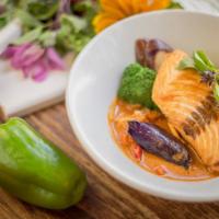 Pla Rad Kang · Grilled salmon fillet served with broccoli, eggplants and bell peppers in basil red curry sa...