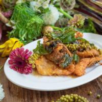 Pla-duk Pad Phed · Spicy crispy catfish in dry red curry sauce with kaffir lime leaves, galangal, and young pep...