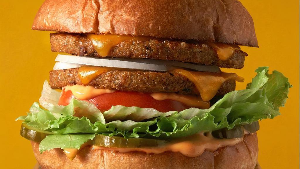 The Amy · Double Veggie Patty, Double Cheese, Lettuce, Tomato, Onion, Pickle, Fred Sr’s Secret Sauce. *Regular contains dairy, gluten & soy.. *Vegan contains  gluten, soy and sunflower.. *GF contains dairy, soy & sunflower.