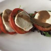 Caprese · Sliced tomatoes and fresh mozzarella, basil, salt, pepper. Topped with extra virgin olive oi...