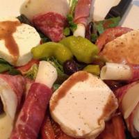 Antipasto Tradizionale · Prosciutto, salami, provolone cheese, fresh mozzarella, over Fresh tomatoes and olives with ...