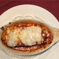 Lasagna Con Carne · Vito's homemade meat and sausage lasagna.