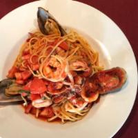 Frutti Di Mare · A Seafood Lover's Delight....Linguini pasta served with shrimp mussels, calamari, and clams ...