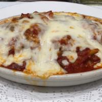 Baked Penne Alla Siciliana · Panno pasta baked with cheese, meat sauce and mushrooms.