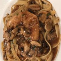 Pollo Alla Marsala · Chicken breast prepared in a marsala wine and mushroom sauce. Served over linguine pasta.