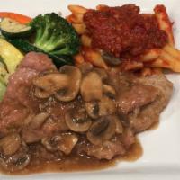 Vitello Alla Marsala · Tender veal deliciously prepared in a marsala wine and mushroom sauce, served with vegetable...