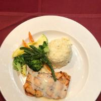 Salmon Ala Griglia · Grilled fresh salmon topped with a creamy white wine sauce. Served with pasta marinara and f...