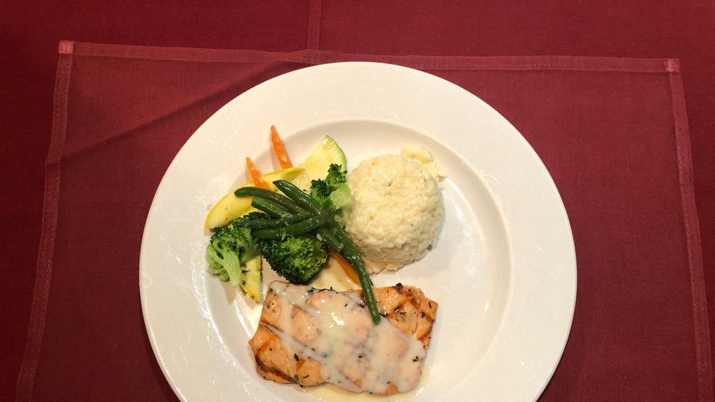 Salmon Ala Griglia · Grilled fresh salmon topped with a creamy white wine sauce. Served with pasta marinara and fresh vegetables.
