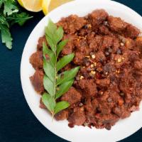 Mutton Sukka (Minced) · Pan roasted minced mutton fry made in caramelized onions, ginger and garlic