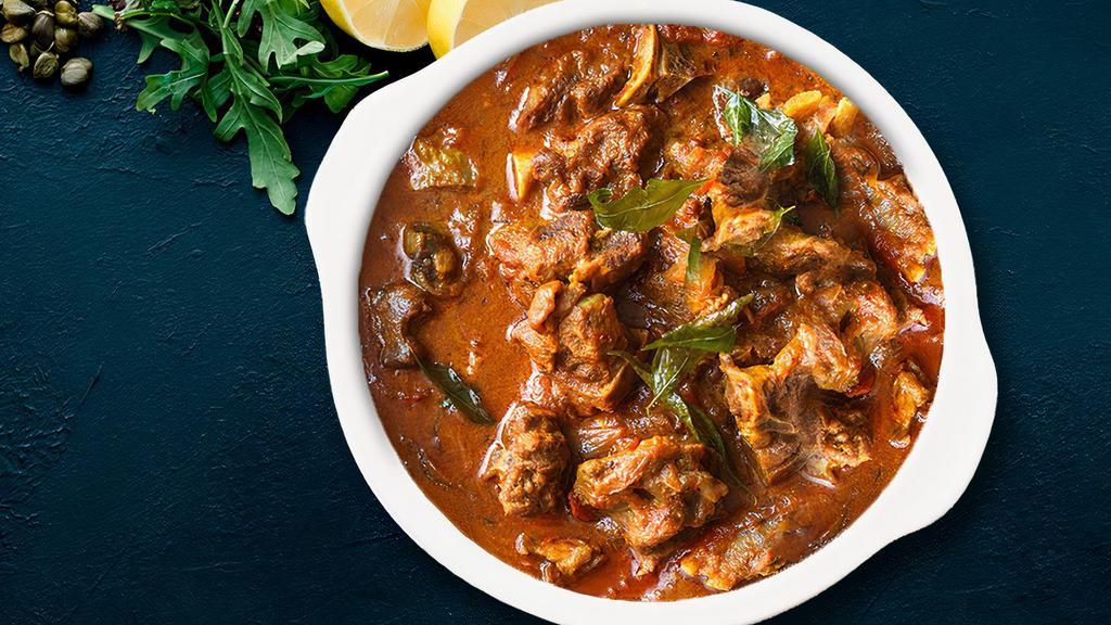Traditional Goat Curry · curry from the Indian subcontinent consists of Goat stewed in an onion- and tomato-based sauce, flavoured with ginger, garlic, tomato puree, chilli peppers and a variety of spices, often including turmeric, cumin, coriander, cinnamon, cardamom