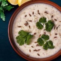 Raita · A simple authentic Raita an Indian yogurt sauce with cucumber, mint and cilantro. Cooling an...