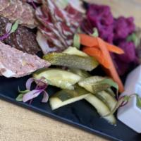 Charcuterie Board · chef's selection of five house made pâtés and cured meats, crostini and accoutrements.