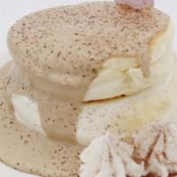 Tiramisu Souffle · Coffee cream, whipped cream, chocolate powder.