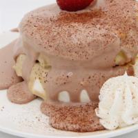 Chocolate Souffle · Dark chocolate cream, whipped cream, fresh straw berry.