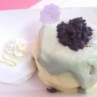 Matcha Green Souffle · Matcha tea cream, fresh red bean, whipped cream.