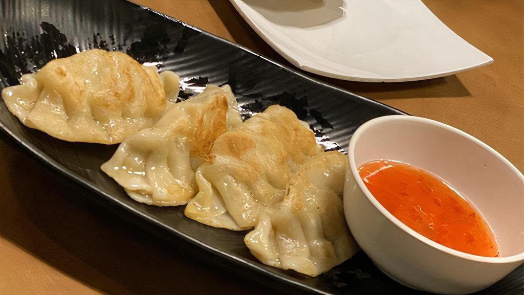 6. Chicken Pot Stickers · Chicken filling and vegetables in wonton wraps served with sweet and sour sauce.