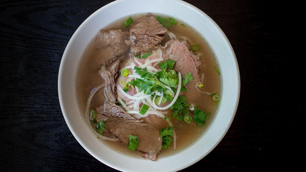 22. Steak & Brisket Phở · Rice noodle served in beef broth with thin rare steak and brisket slices.