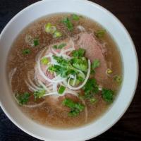 23. Rare Steak Phở · Rice noodle served in beef broth with rare steak slices.