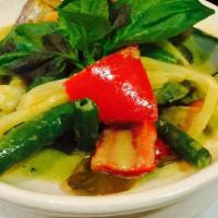 Green Curry · Green curry in coconut milk, bell pepper, bamboo shoot, green bean, eggplant and sweet basil.
