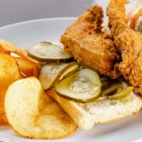 Fried Chicken · Curtido slaw, xingones remoulade, pickles, and house-made chips.