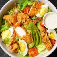 Cobb · Fried chicken breast, bacon, egg, cherry tomatoes, blue cheese, romaine, avocado, and house-...
