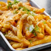 Xingones Fries · Seasoned fries covered in cheddar cheese, topped with buffalo mayo, chicharrones, sour cream...