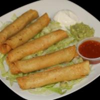 Taquitos Dorados · Five crispy shredded chicken rolled tacos, lettuce, guacamole, sour cream, and fresh salsa. ...