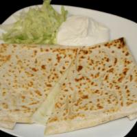 Quesadilla de Harina
 · Flour Tortilla, melted Cheese, Sour Cream, and Lettuce