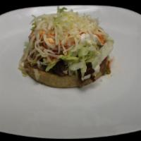 Sope · A Thick Fried Tortilla, With Choice of Meat, Beans, Lettuce, Sour Cream, Cheese, and Salsa
