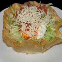 Taco Salad
 · Choice of Meat, Rice, Beans, Cheese, Sour Cream, Guacamole, Salsa, and lettuce, on a crispy ...