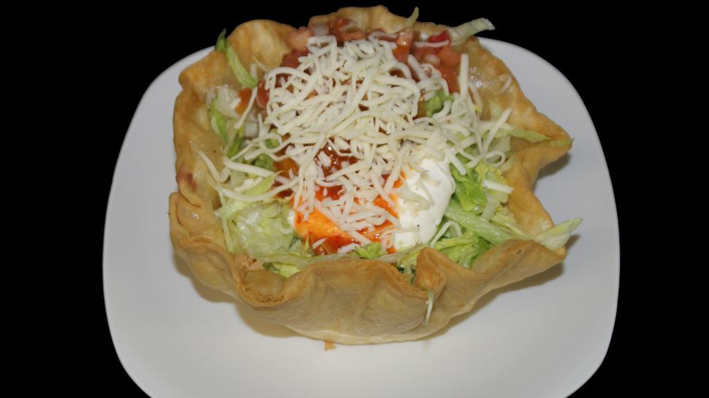 Taco Salad
 · Choice of Meat, Rice, Beans, Cheese, Sour Cream, Guacamole, Salsa, and lettuce, on a crispy shell.