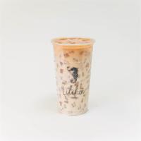 Brown Oolong Crema · Honey oolong tea topped off with our signature cheese foam. 24oz.