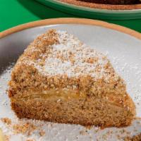 Apple Cardamom Crumb Cake Slice · Our biggest seller, a warm cinnamon-spiced cake, baked with fresh apples and topped with a s...