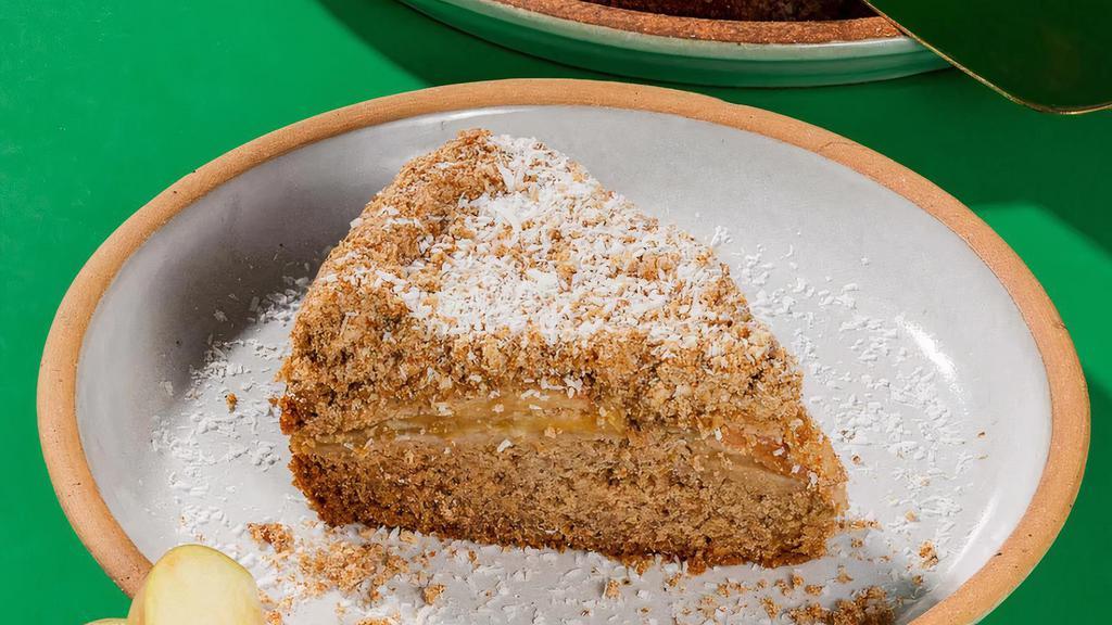 Apple Cardamom Crumb Cake Slice · Our biggest seller, a warm cinnamon-spiced cake, baked with fresh apples and topped with a sweet and salty cardamom crumble. *Nut Free*