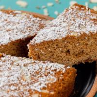 Almond Tea Cake Slice · Delicious and fluffy Almond Cake baked with sliced almonds and topped with shredded coconut....