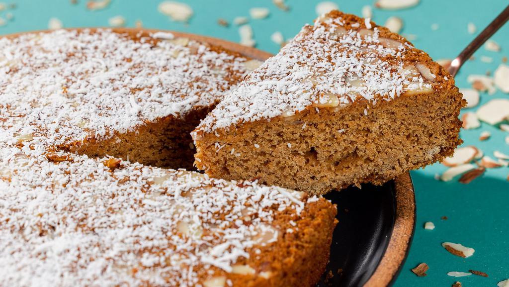 Almond Tea Cake Slice · Delicious and fluffy Almond Cake baked with sliced almonds and topped with shredded coconut. Perfect with a cup-a-tea!