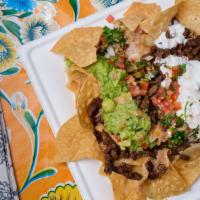 Super Duper Nachos with Meat · Gmo free chips, refried beans, jack cheese, guacamole, and sour cream, your choice of chicke...